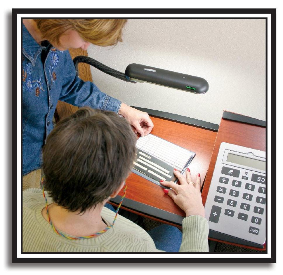 photo of occupational therapist helping woman use a page magnifier on checkbook