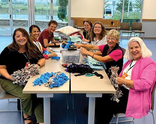 Photo of several members of the Health District’s Ruff Around the Edges 5K team enjoyed a VIP tour at the NOCO Humane Larimer Campus that included making snuffle mats for dogs staying at the shelter.